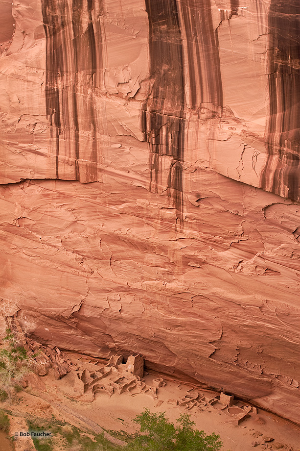 Desert varnish streaks the 800 foot wall above Antelope House