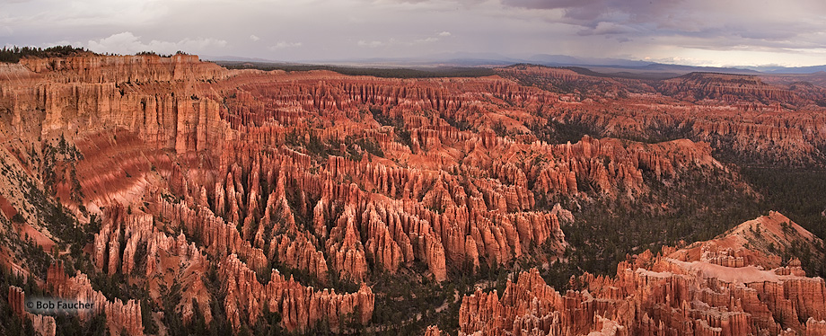Bryce Amphitheater under stormy skies with evening light as seen from Bryce Point.