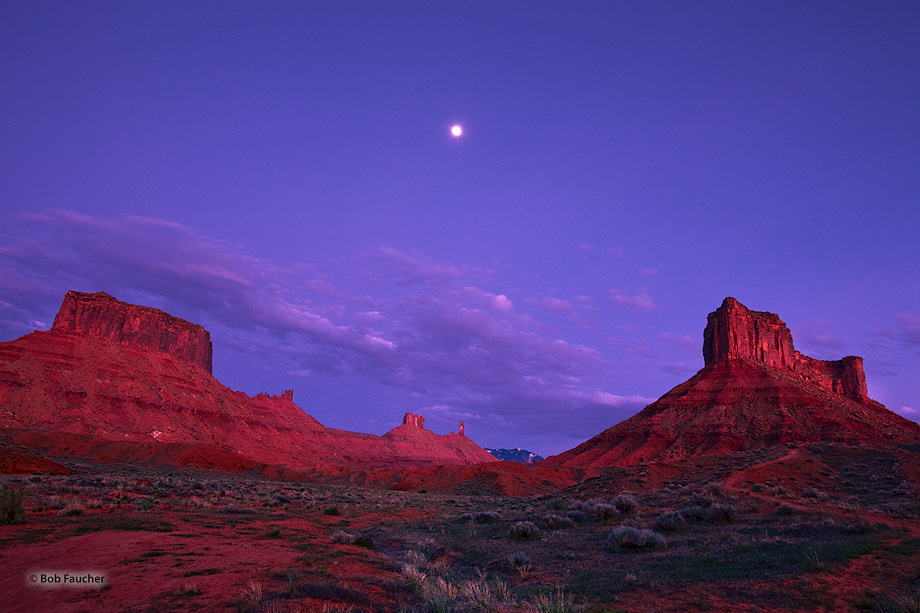 Castle Valley, located between Adobe Mesa and Porcupine Rim, with the moon balanced above