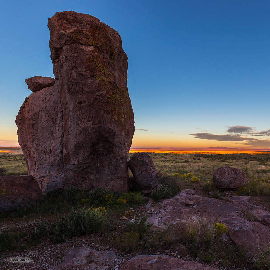 The first rays of morning sun over the Cooke Range to the east light up the surrounding desert floor to the west. The "city"...