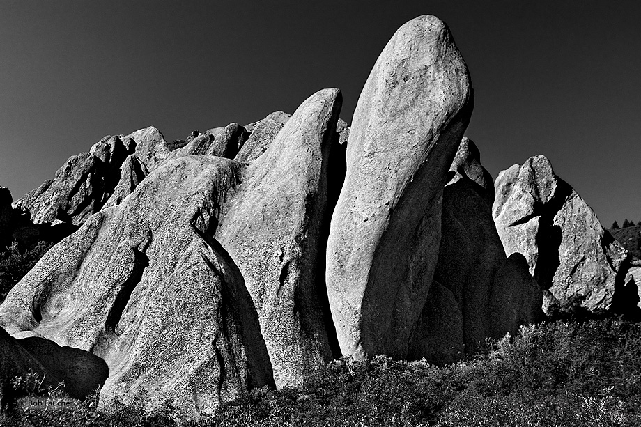 A singular rounded rock stands out among the more angular and sharper rocks in this formation in Roxborough Park
