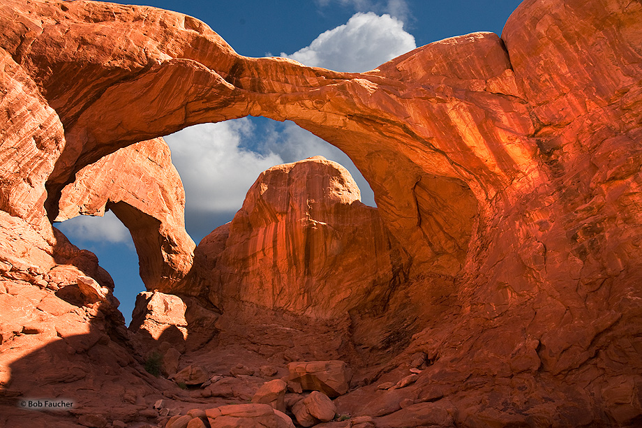 The massive arches of Double Arch were formed by water erosion from above rather than more typical erosion from the side. The...