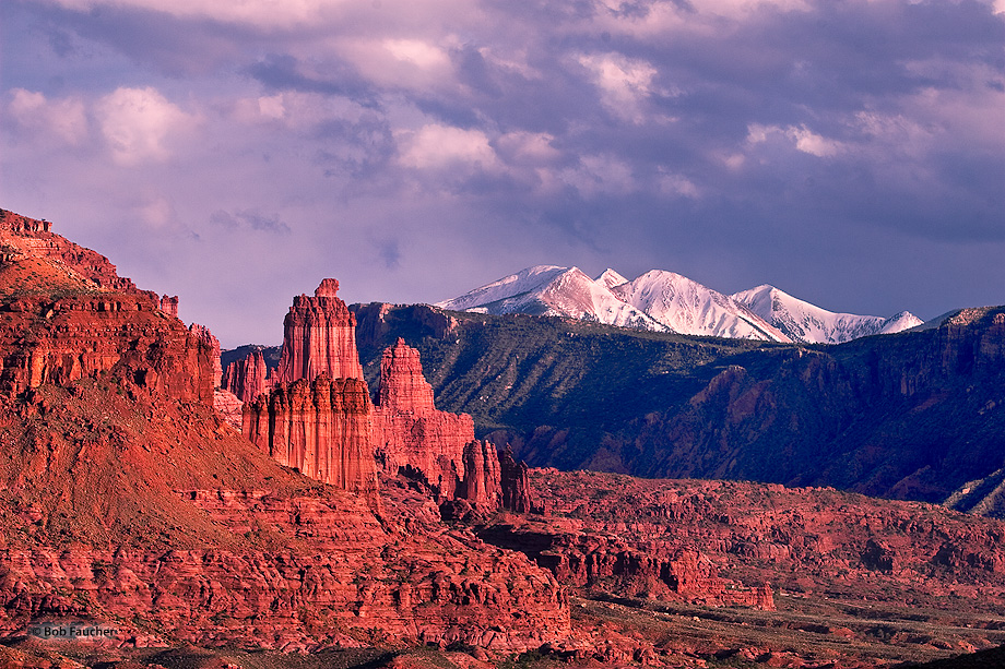 Fisher Towers glow their signature deep red with strong sidelight near the end of the day.