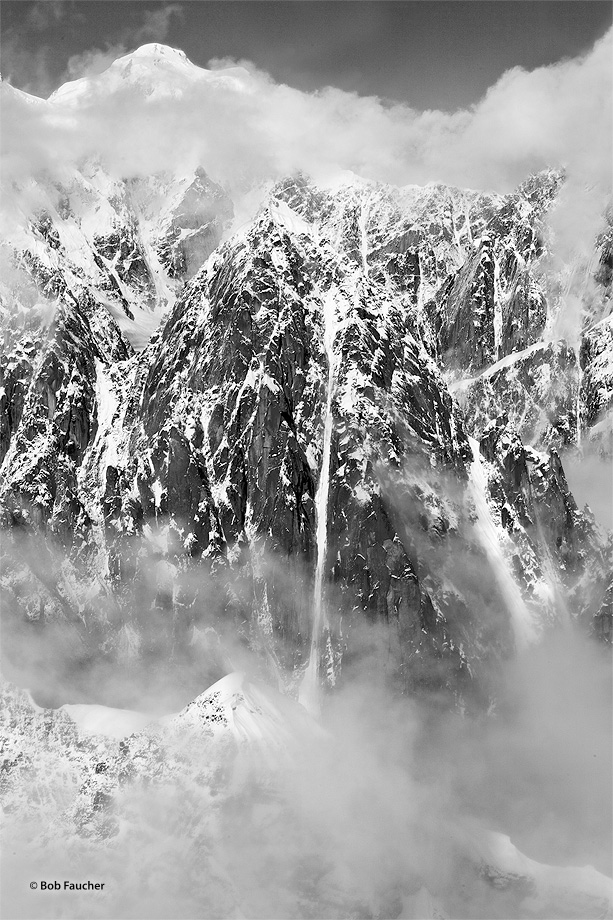 Ice in an avalanche chute forms a frozen waterfall