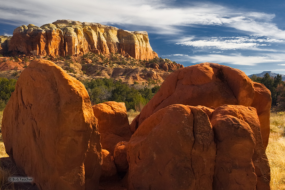 Triassic and Jurassic sedimentary rocks form this cliff near the Box Canyon trail at Ghost Ranch. The brick-red Chinle Group...