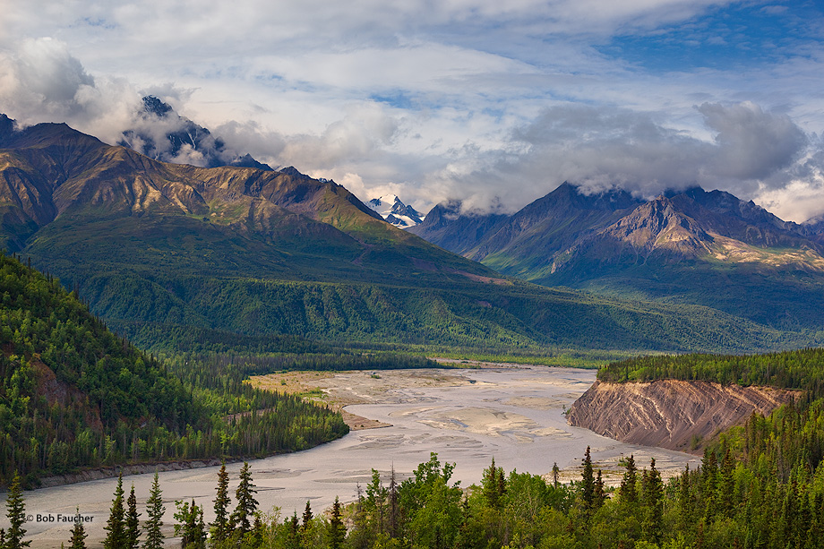 Chugach Mountain peaks—Mt. Sargeant Robinson and Mt. Goode—tower over the Matanuska River as morning sunlight highlights...