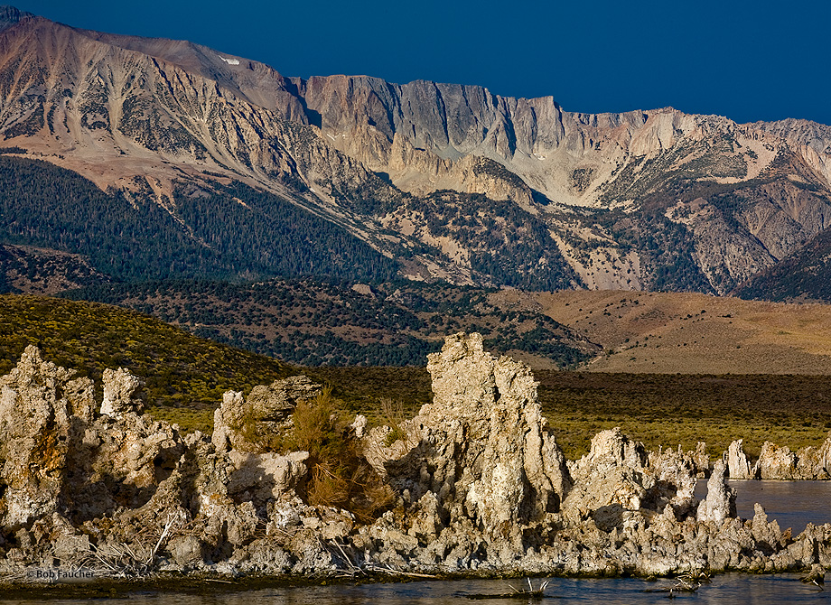 Mid-morning light catches the sheer face of the Sierra Escarpment as it towers over tufa in Mono Lake