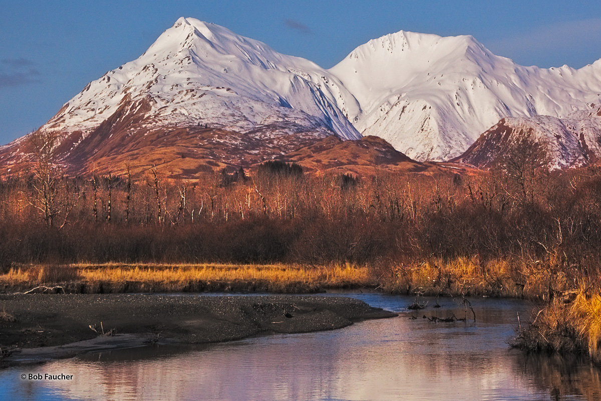 The Marin Range is reflected on the Olds River, which heads in an unknamed lake below the Range, as it flows NE 13 miles, the...