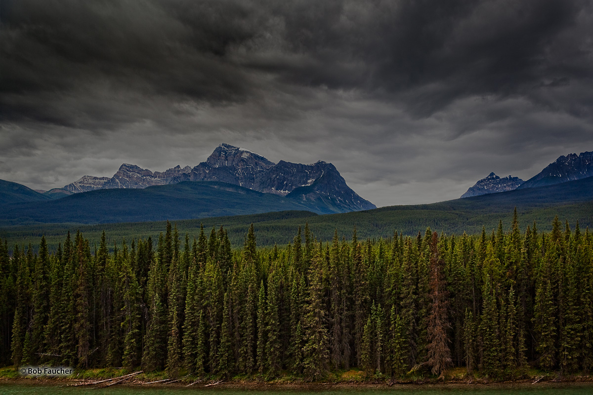 Threatening clouds pass over Storm Mountain in Banff NP