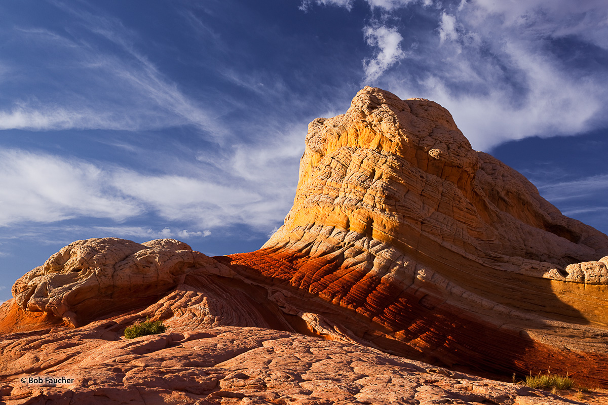 Late afternoon light shows off the variously-colored striated layers in the well-known formation, Lolloipop Rock, in White Pocket...