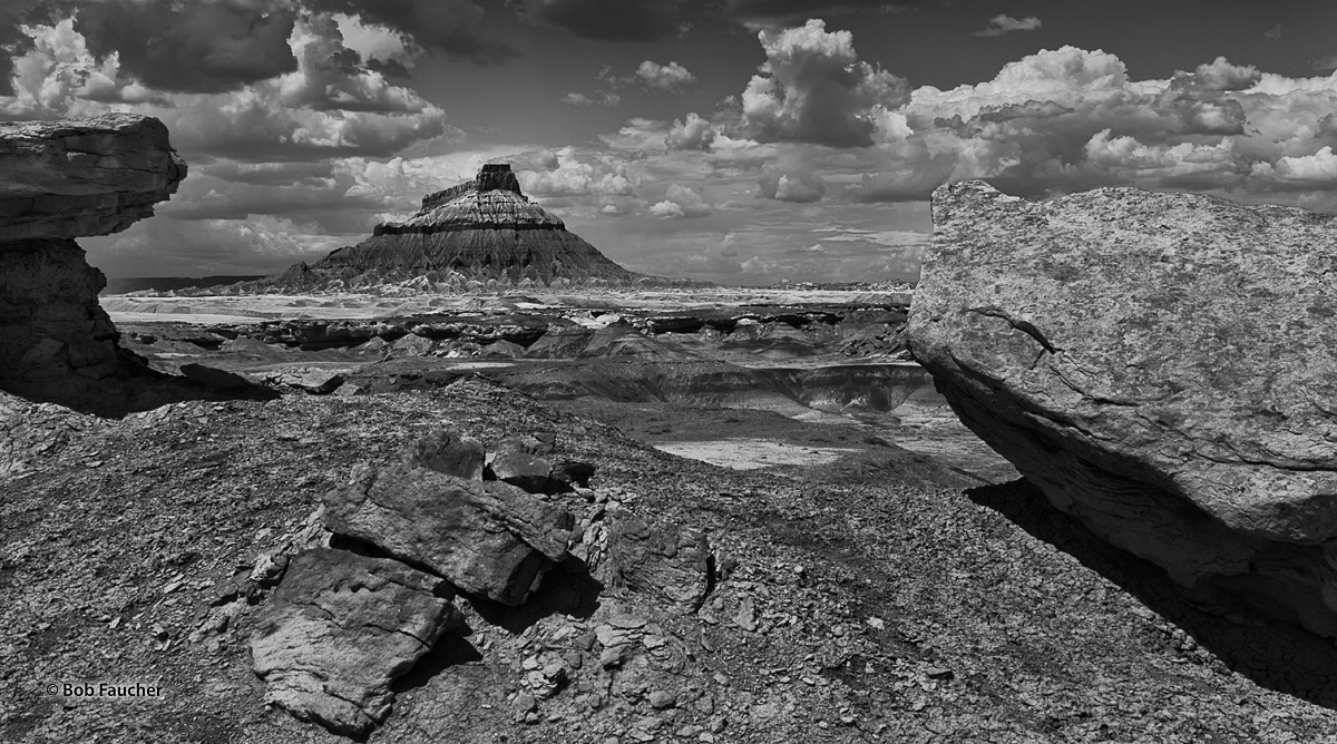 A more direct view of Factory Butte, framed by boulders