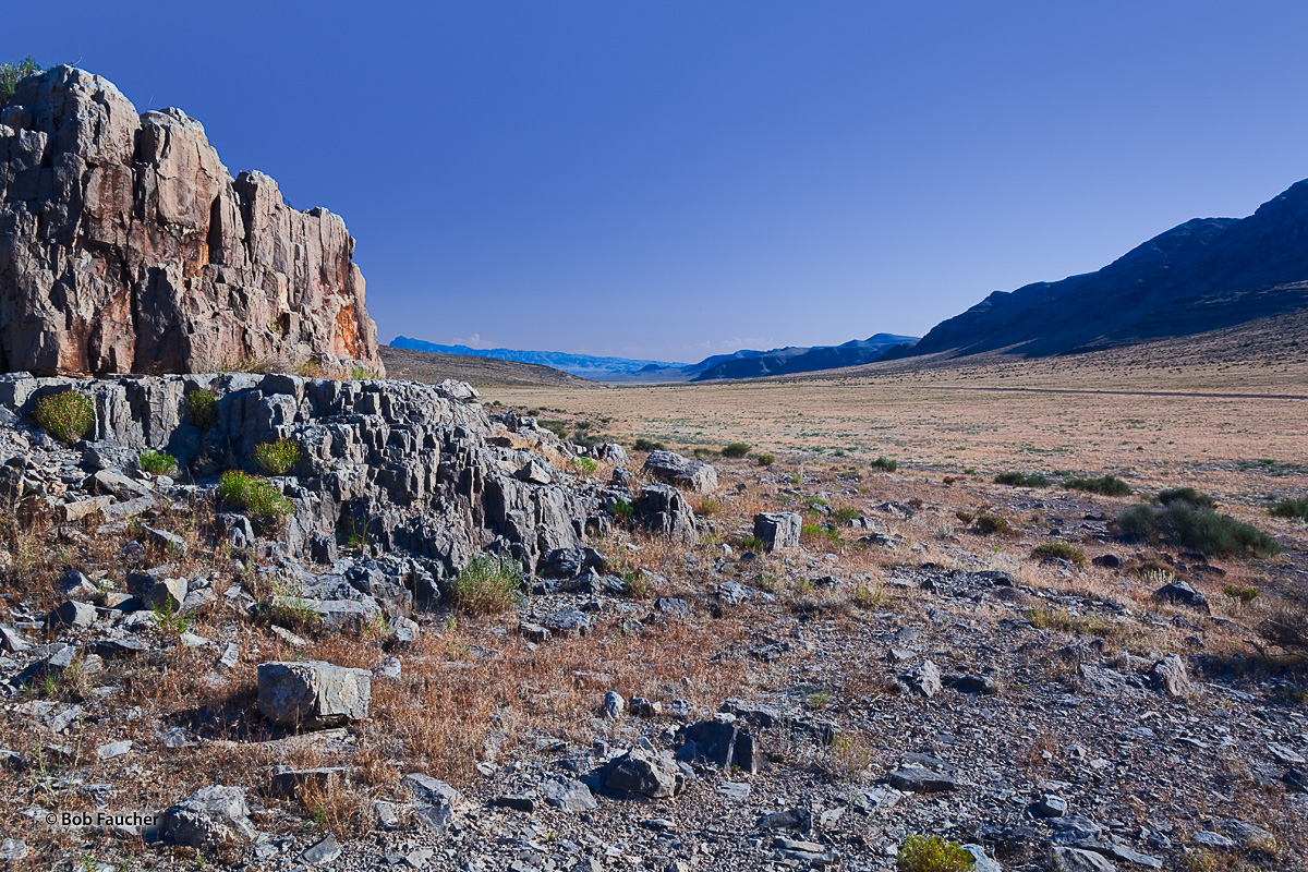 Northern view up the Tule Valley as morning sun rises above the House Range and strikes a rugged rock formation in the valley