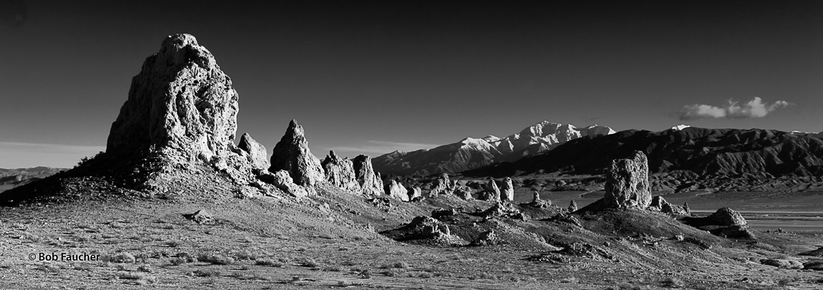 Snow covered peaks in the lower Sierras form a dramatic backdrop for tufa formations in Tronas Pinnacles, a National Natural...