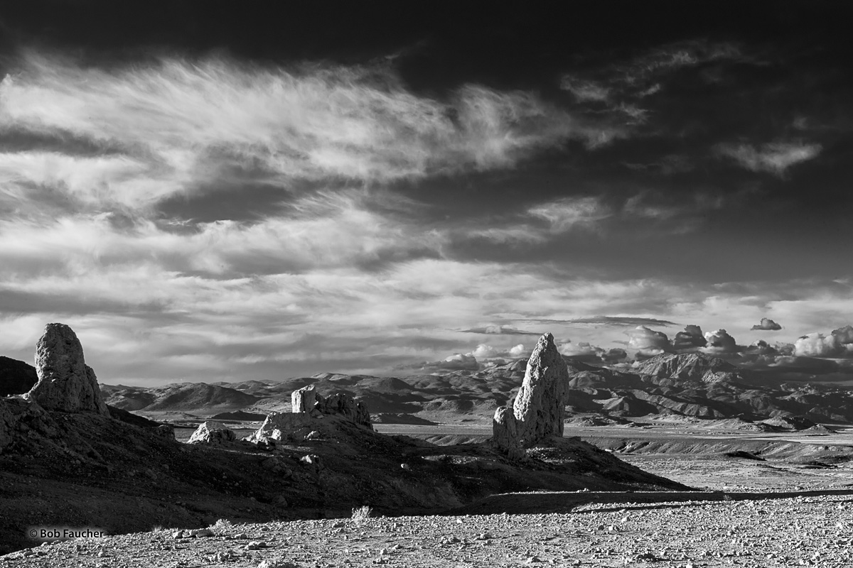 Late evening light casts lengthy shadows of some tall tufa spires in Trona Pinnacles, a National Natural Landmark in the Searles...
