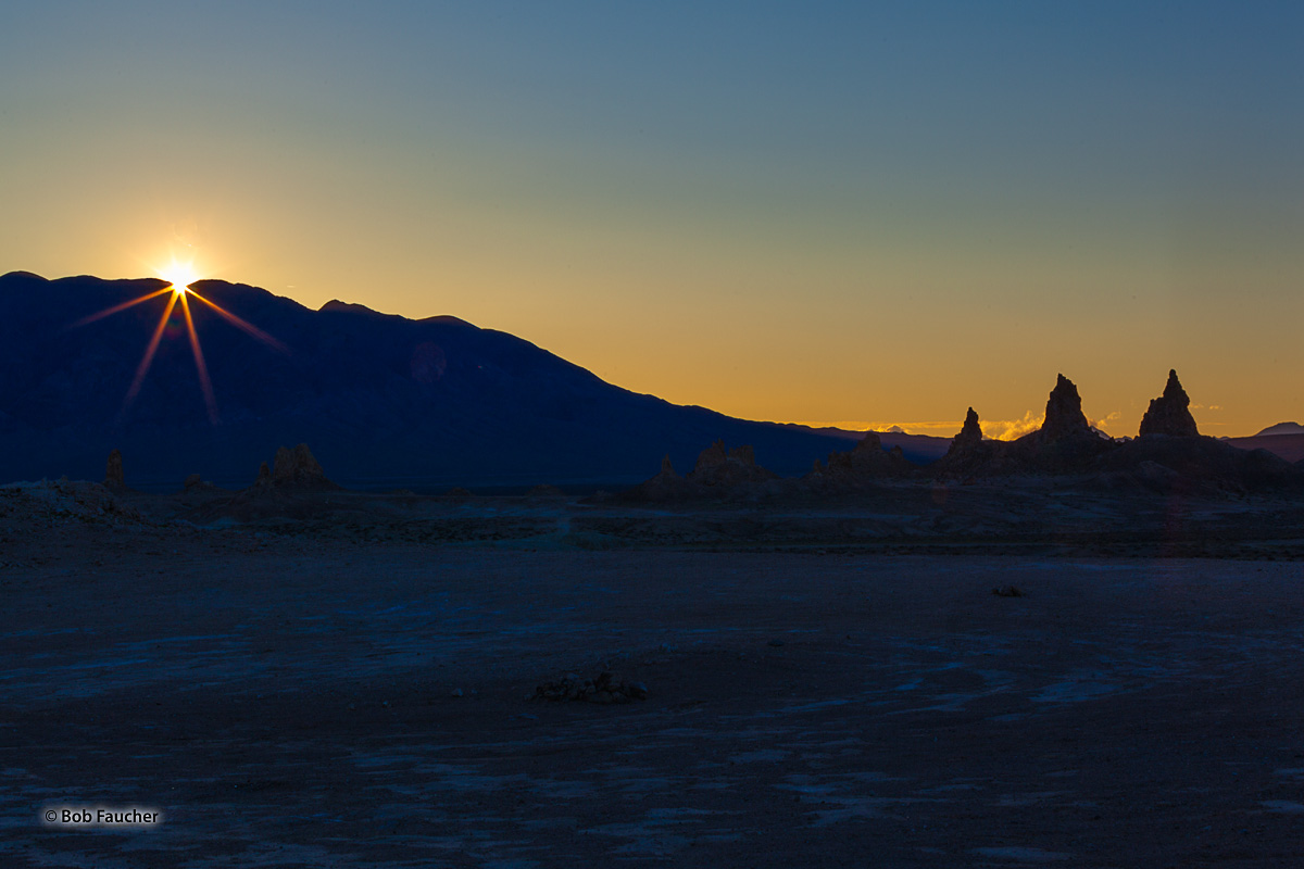 The sun breaks over the Slate Range, heralding a new day in Trona Pinnacles, a National Natural Landmark in the Searles Lake...