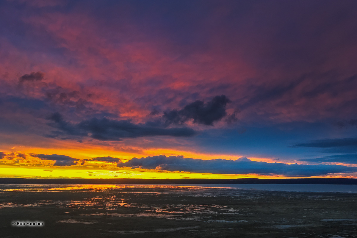 Colorful sunset over Goose Lake, in the Goose Lake Valley on the Oregon–California border in the United States. Like many other...