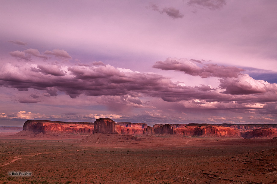 Late afternoon light graces the face of the Rain God Mesa in Monument Valley