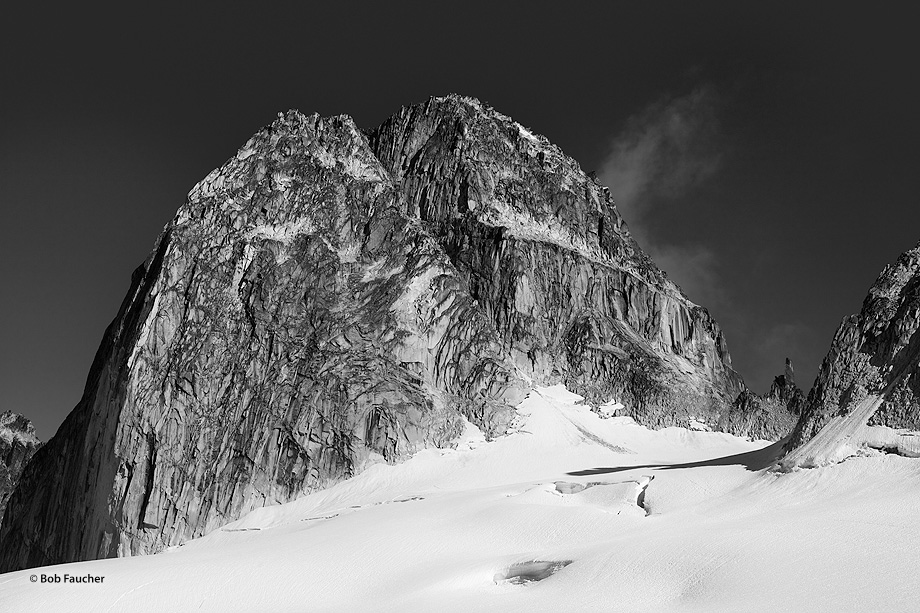 Towering rock formation appears like a dome that is splitting vertically