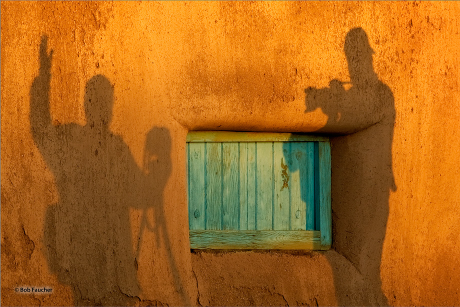 While making photographs of one of the shuttered windows in the walls of Taos Morada, the two photographer's shadows interacted...