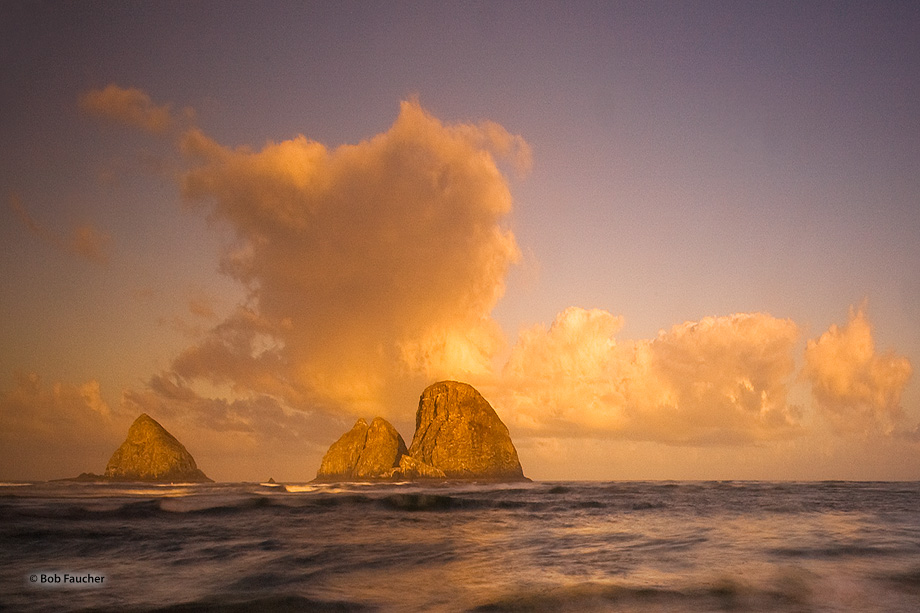 Strong first light captures the eponymous rocks and clouds above them in a spectacular display