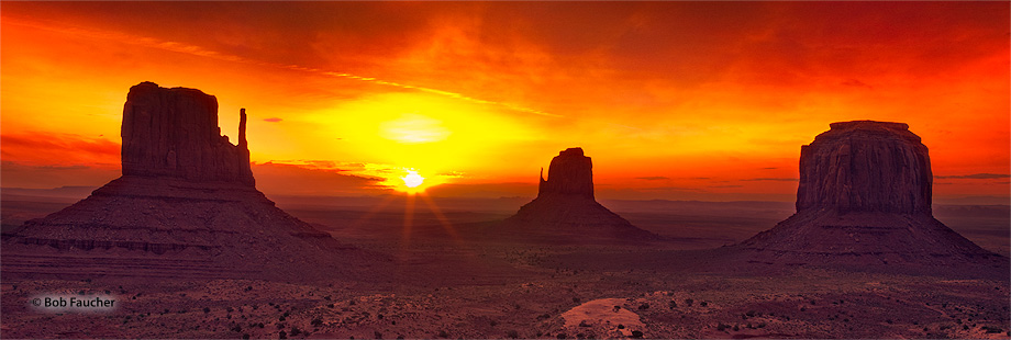 East and West Mitten and Merrick Buttes, seen here at sunrise, are distinctive geological features found within Monument Valley...