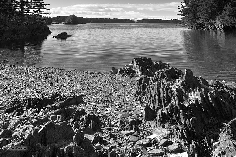 Shale rocks, visible and negotiable on foot only at low tide, lead your eye from Near Island out to Twin Islet