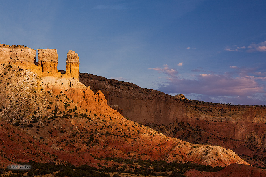 Portal rock glows in the late afternoon sun as shadows from the mountains to the west rise from the valley floor